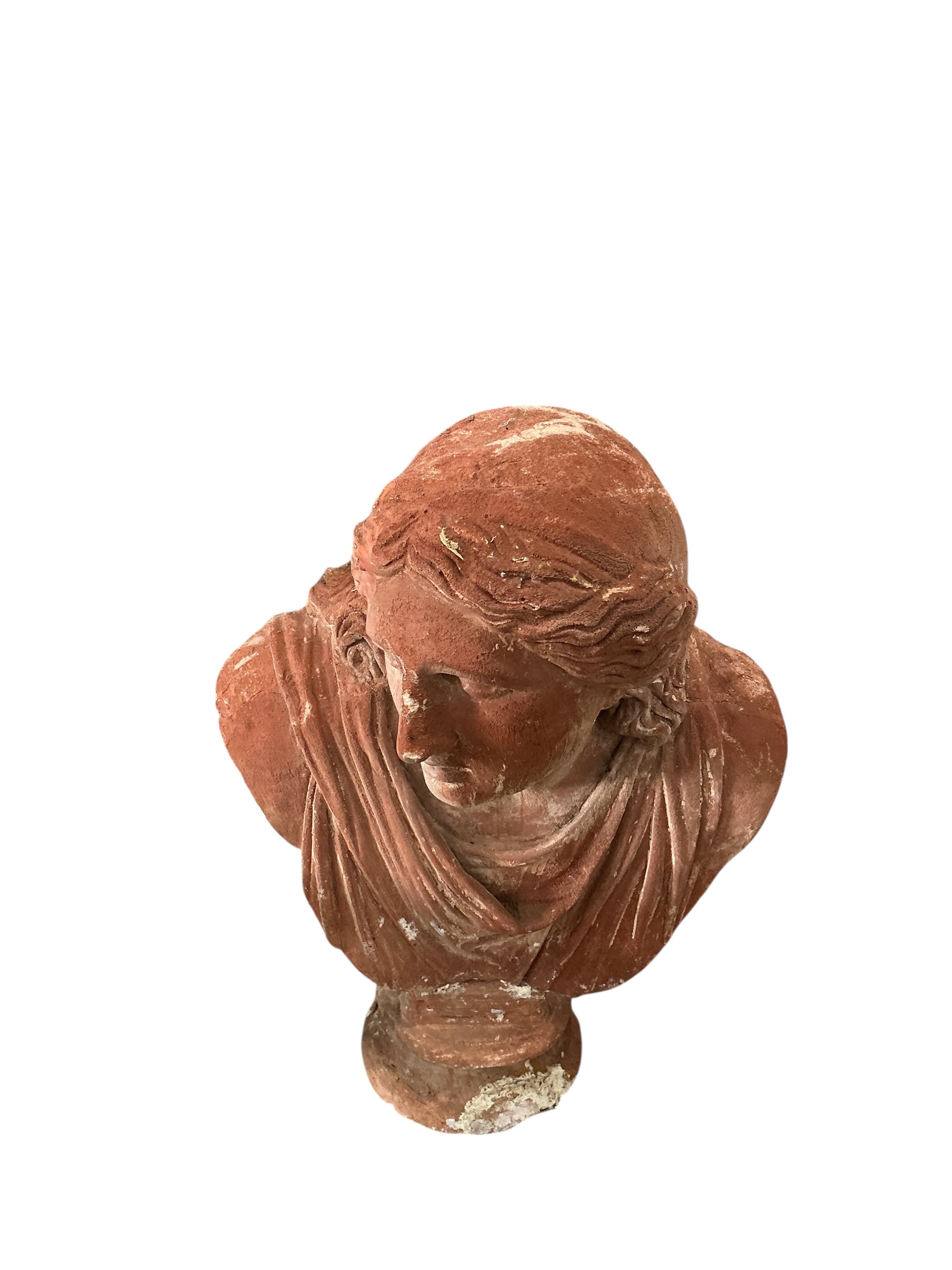 A pair of Neoclassical Revival terracotta busts on fluted pedestals, larger height 188cm, Provenance: The late Kenneth Turner (1936-2025), celebrity florist, designer and perfume retailer, he received the Royal Warrant f